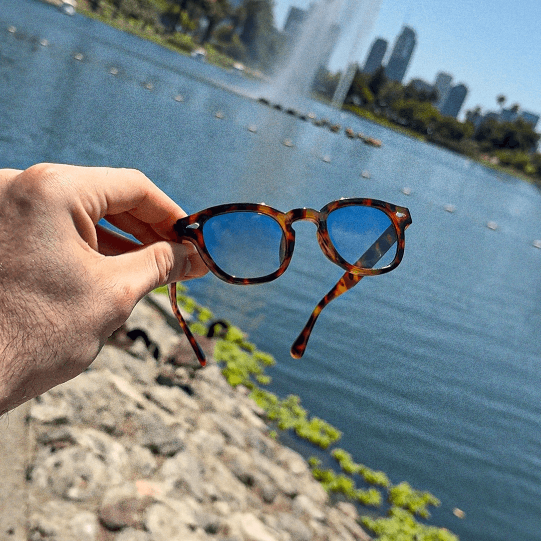 Tortoise frames held over a lake